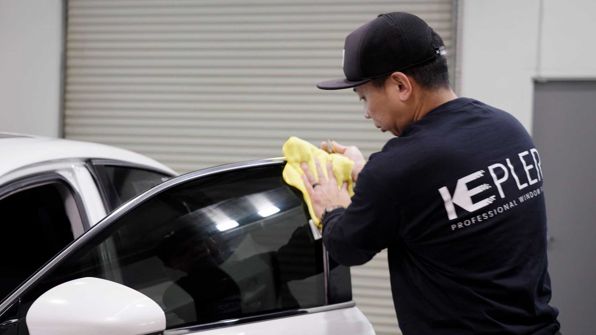 Professional Car Window Tint being cleaned after tinting in Naples