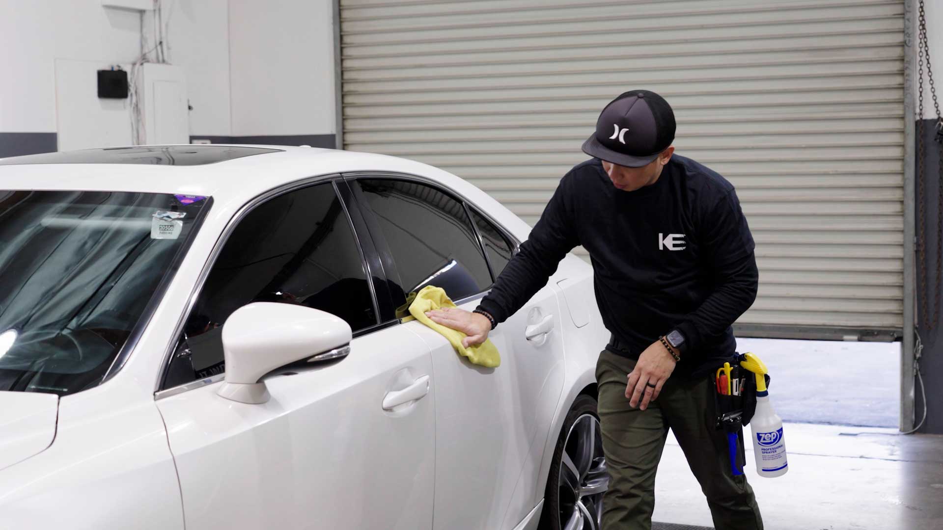 Skilled Vehicle Glass Tint being cleaned after tinting in Sarasota