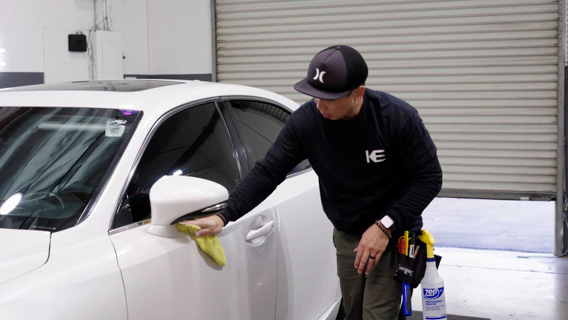 Skilled Vehicle Window Tinting being cleaned after tinting in Janesville
