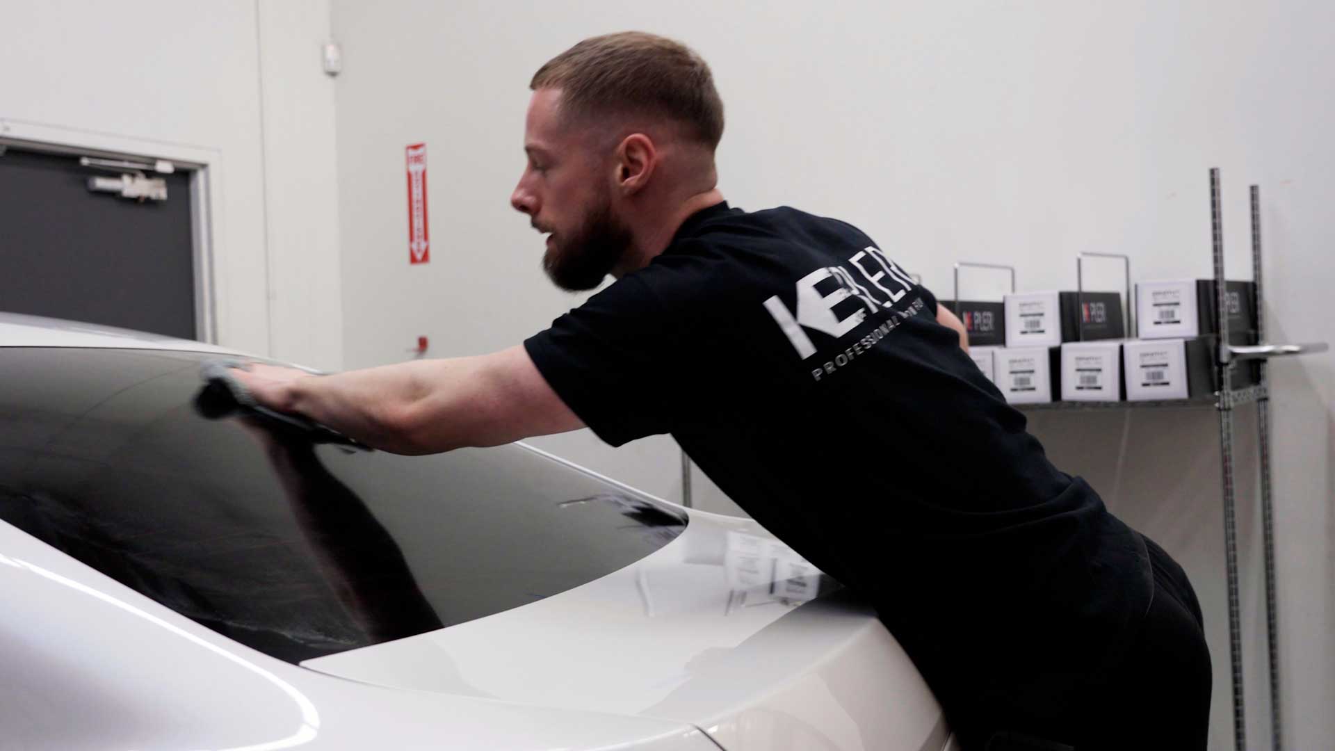 Professional Vehicle Glass Tint being cleaned after tinting in Janesville