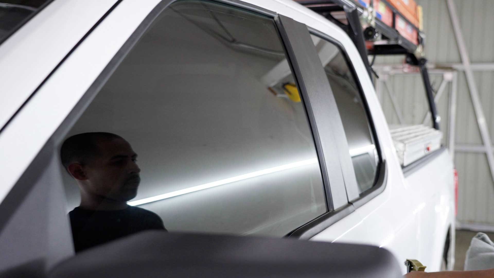 Skilled Automotive Glass Tint being cleaned after tinting in North Chicago