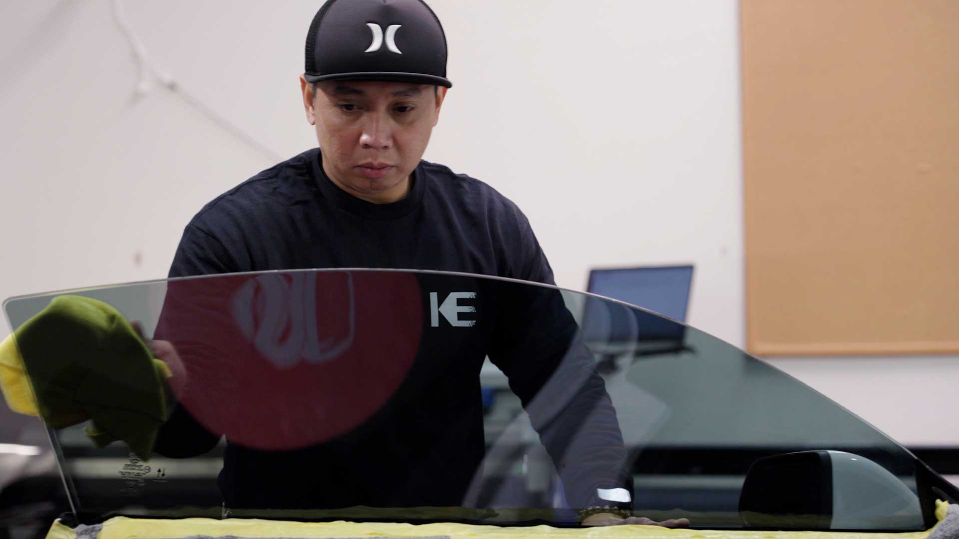 Professional Automotive Window Tint being cleaned after tinting in West Warwick