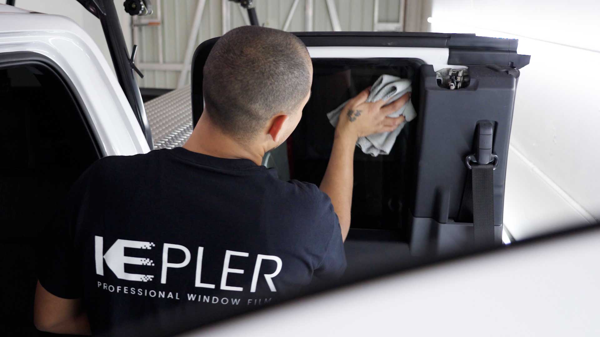 Expert Automotive Window Tint being cleaned after tinting in Johnston