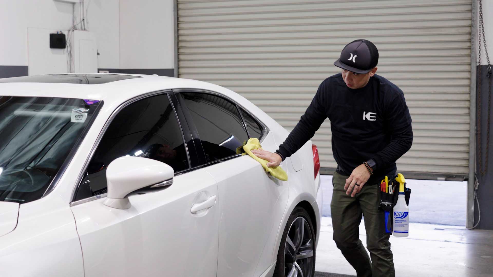 Professional Car Glass Tint being cleaned after tinting in Irvington