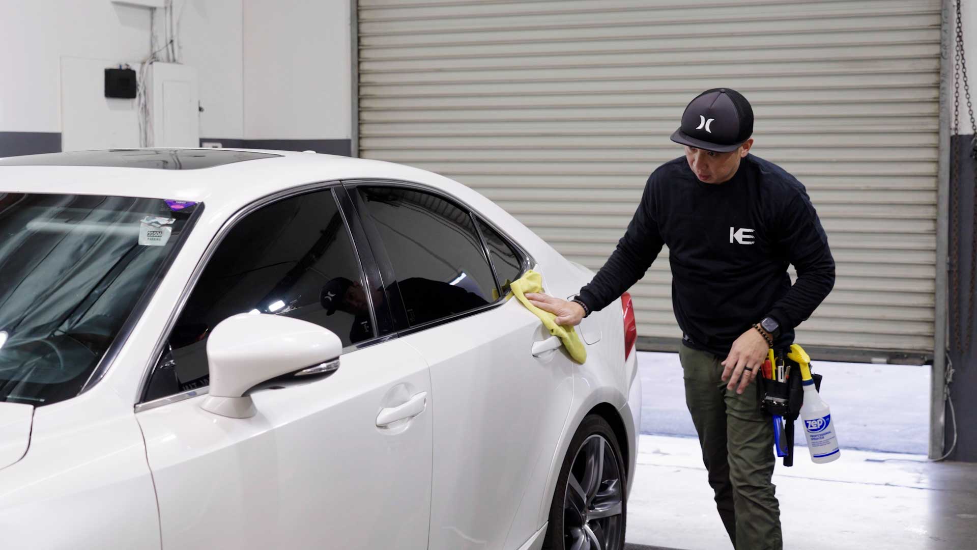 Professional Automotive Glass Tinting being cleaned after tinting in Bellmore