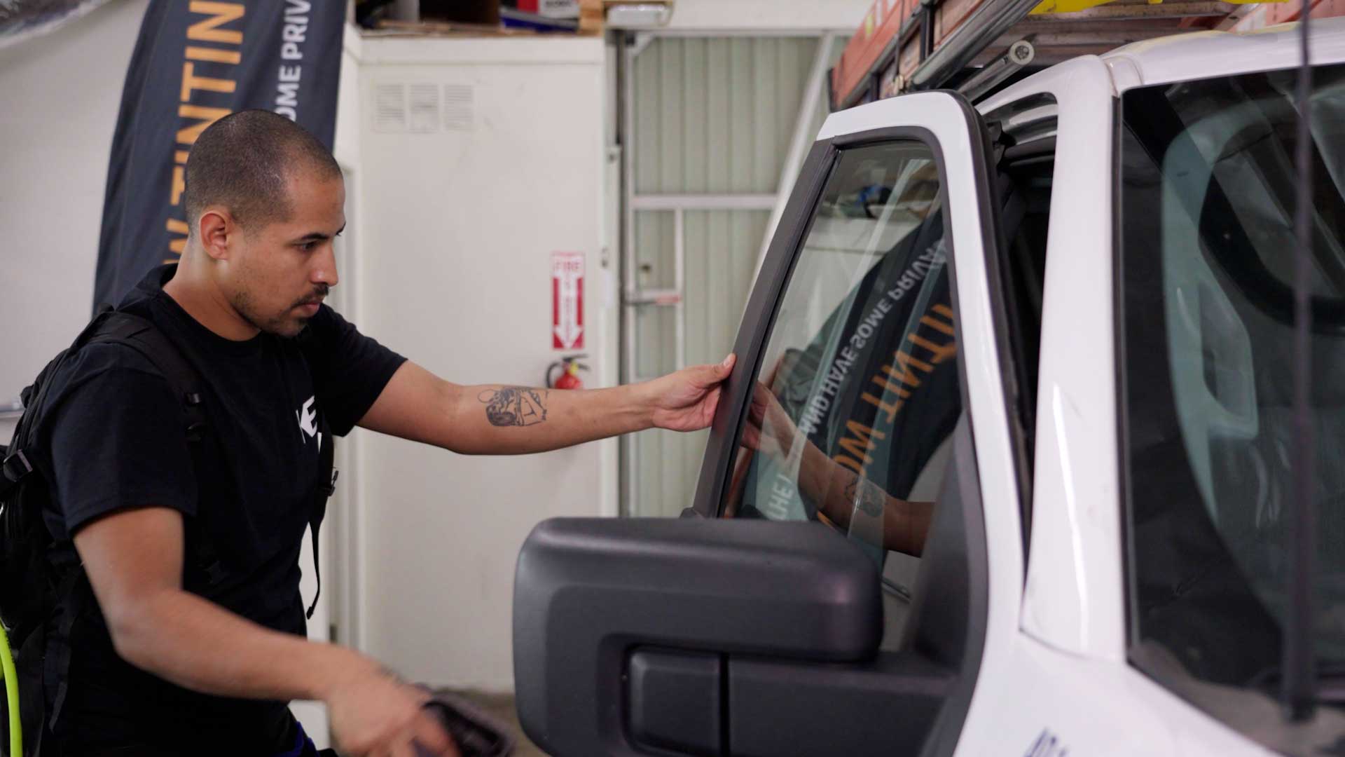Skilled Vehicle Window Tinting being cleaned after tinting in Coram
