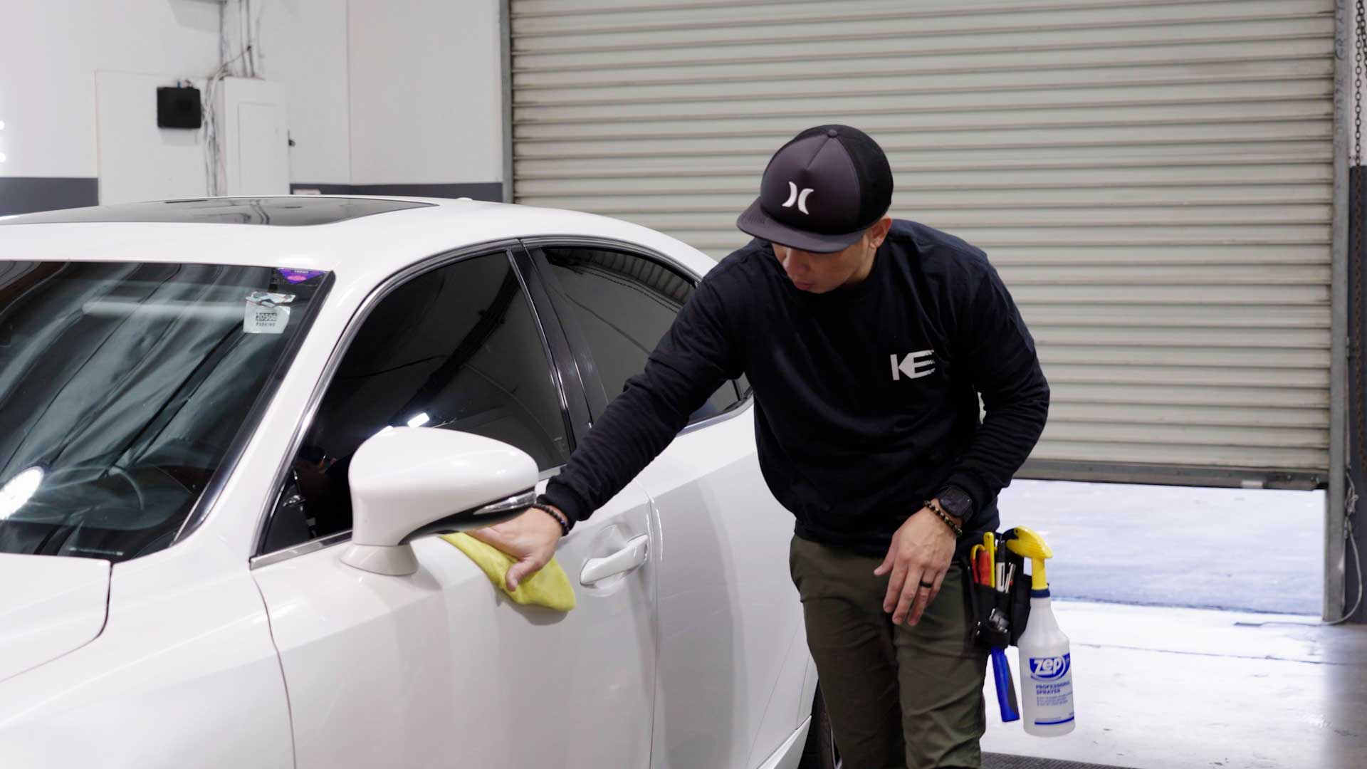 Professional Automotive Window Tint being cleaned after tinting in Oswego
