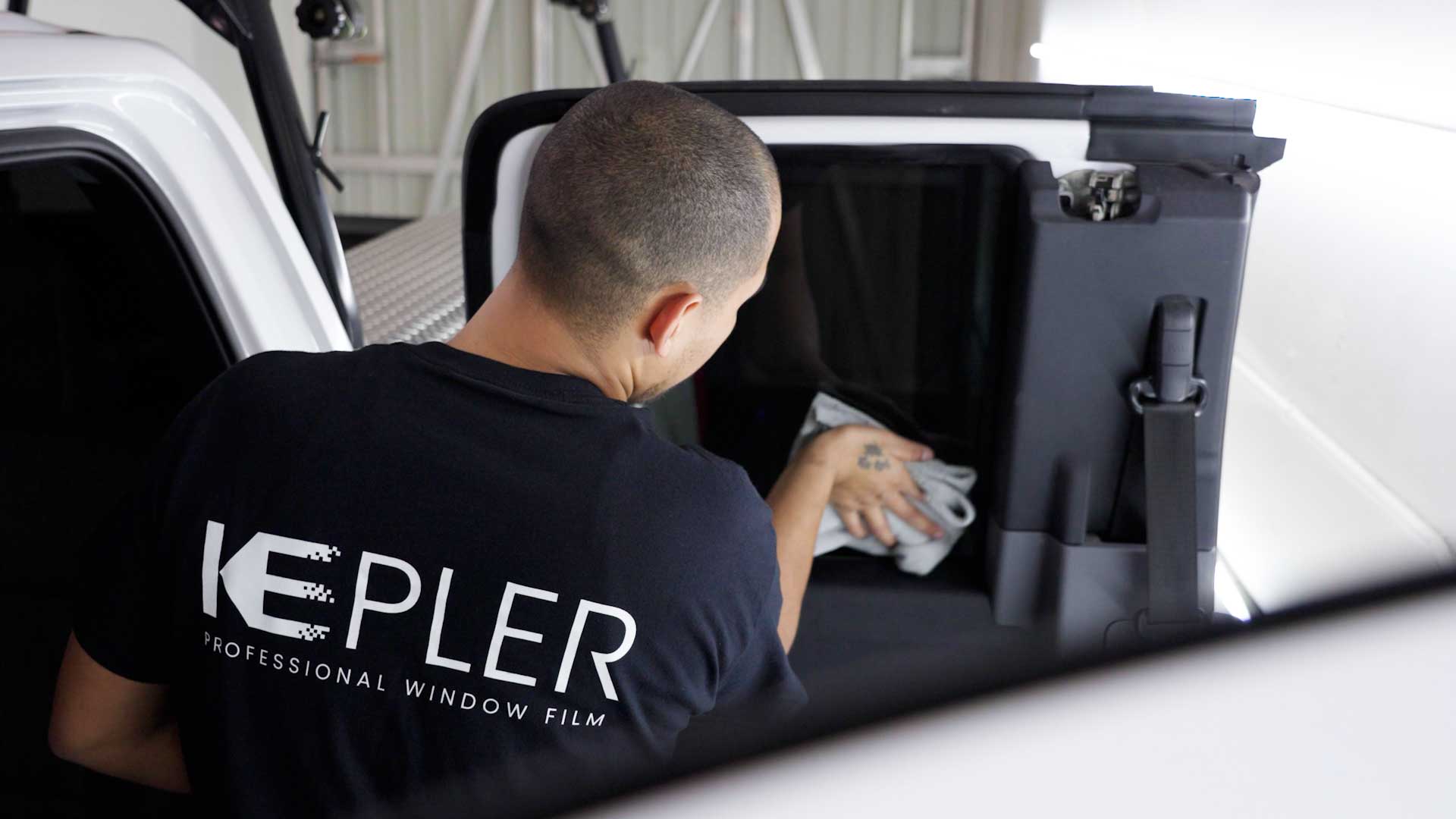 Skilled Car Window Tint being cleaned after tinting in Haines City