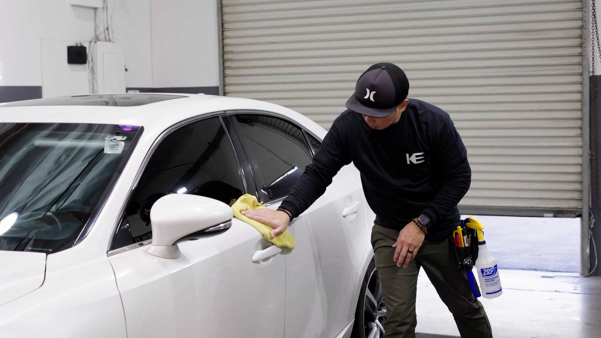 Professional Automotive Window Tinting being cleaned after tinting in Belle Glade