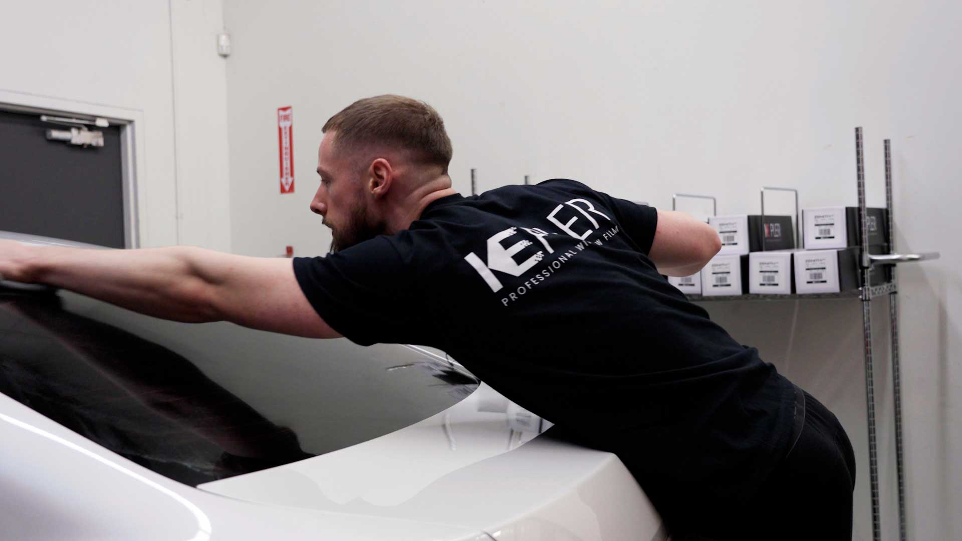 Skilled Automotive Glass Tint being cleaned after tinting in Mission Viejo