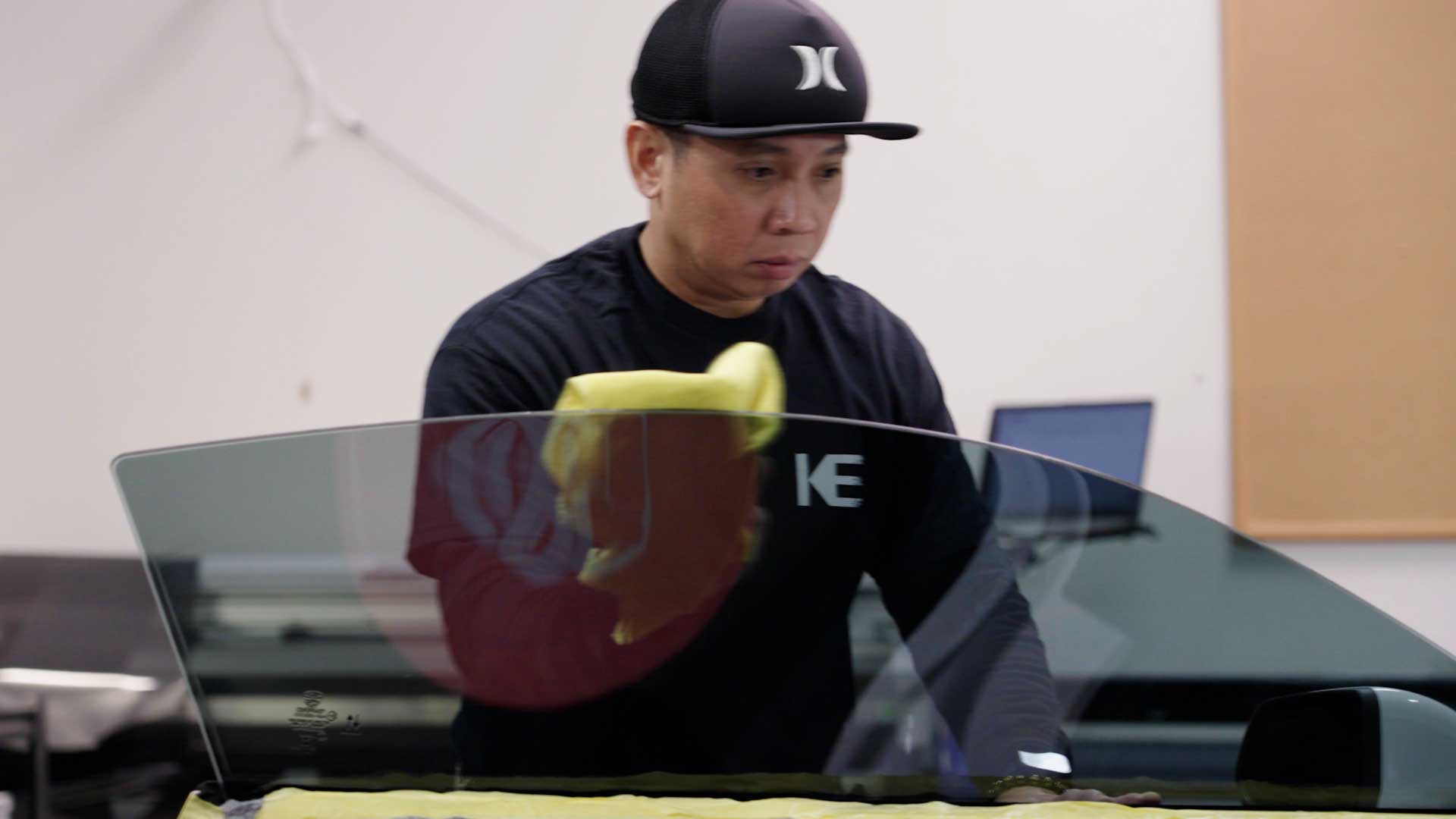 Skilled Car Window Tinting being cleaned after tinting in Merrillville