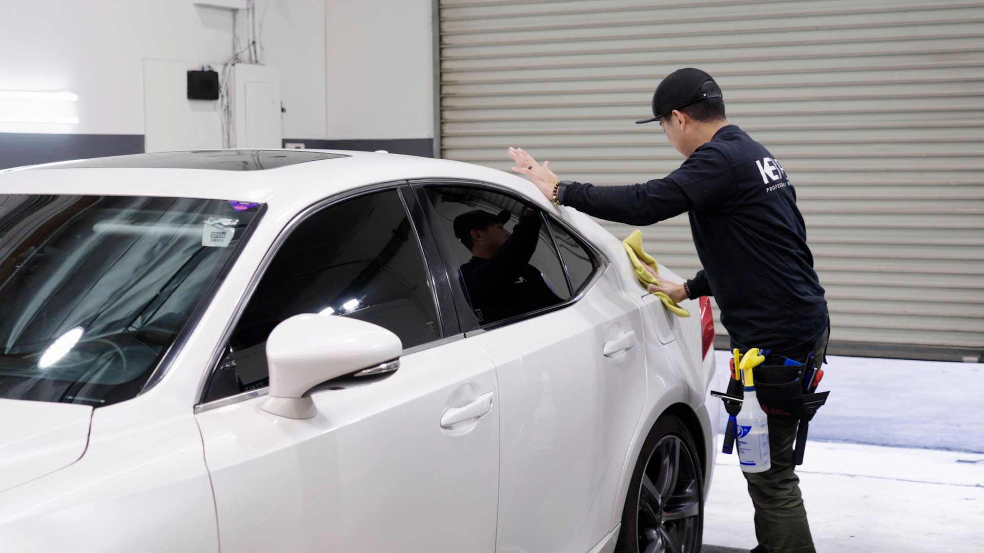 Skilled Car Window Tinting being cleaned after tinting in Cedar Rapids