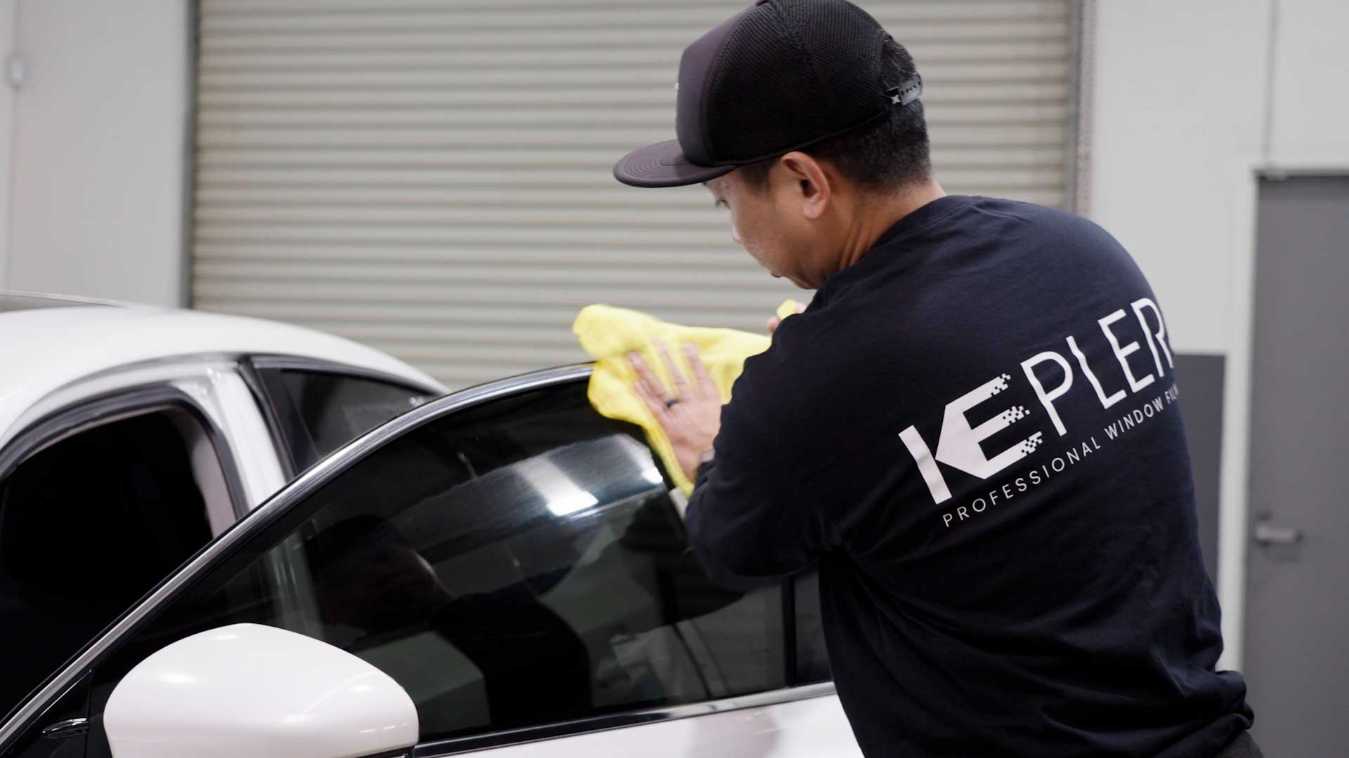 Professional Vehicle Window Tint being cleaned after tinting in Plainfield