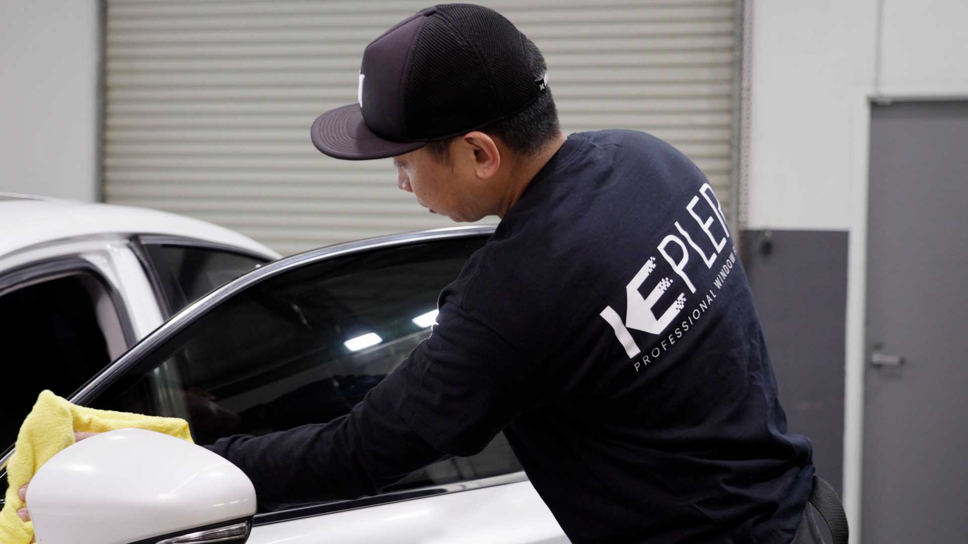 Skilled Automotive Glass Tint being cleaned after tinting in Rexburg
