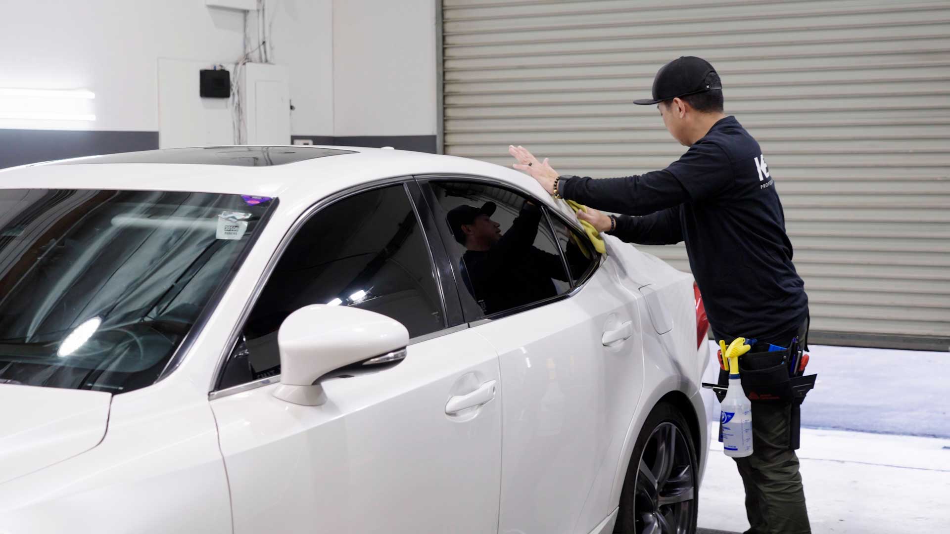Professional Car Glass Tint being cleaned after tinting in Orem