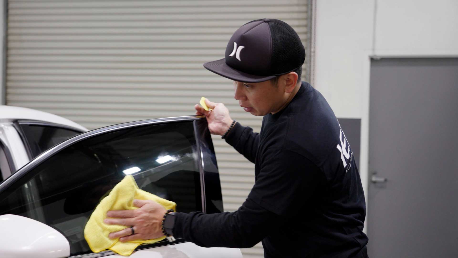 Skilled Vehicle Window Tinting being cleaned after tinting in Casa Grande