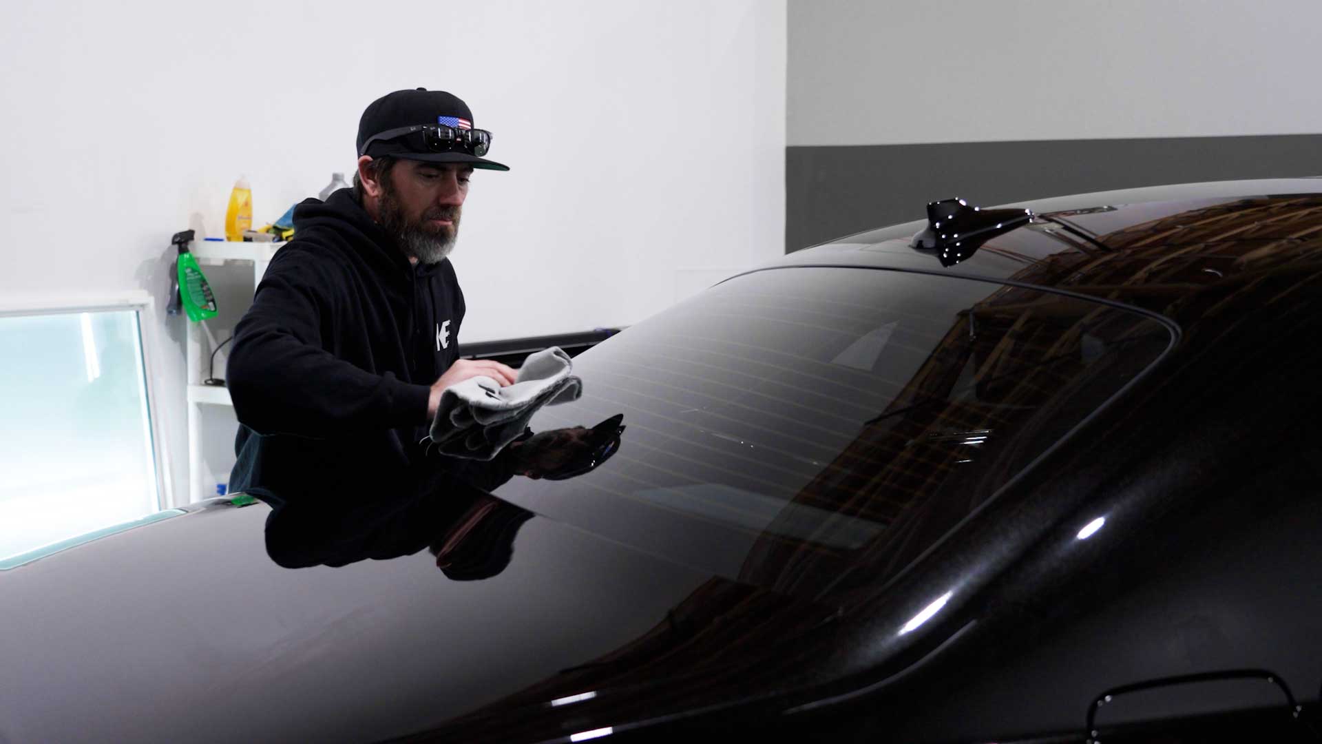 Skilled Automotive Glass Tint being cleaned after tinting in Nogales