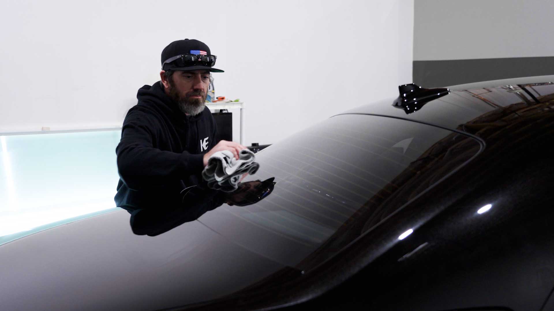Skilled Vehicle Glass Tinting being cleaned after tinting in Escondido
