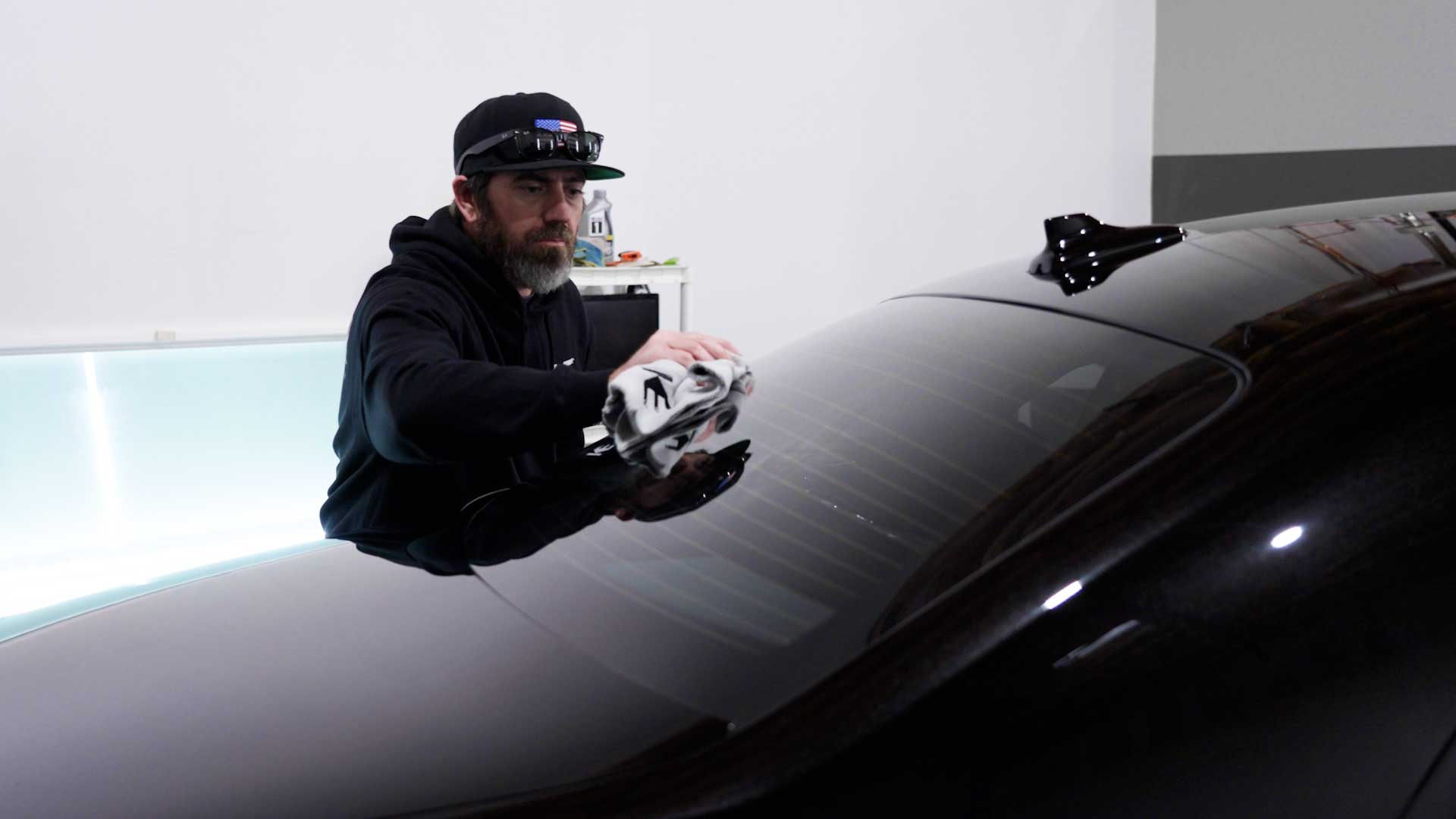 Professional Automotive Window Tinting being cleaned after tinting in Visalia
