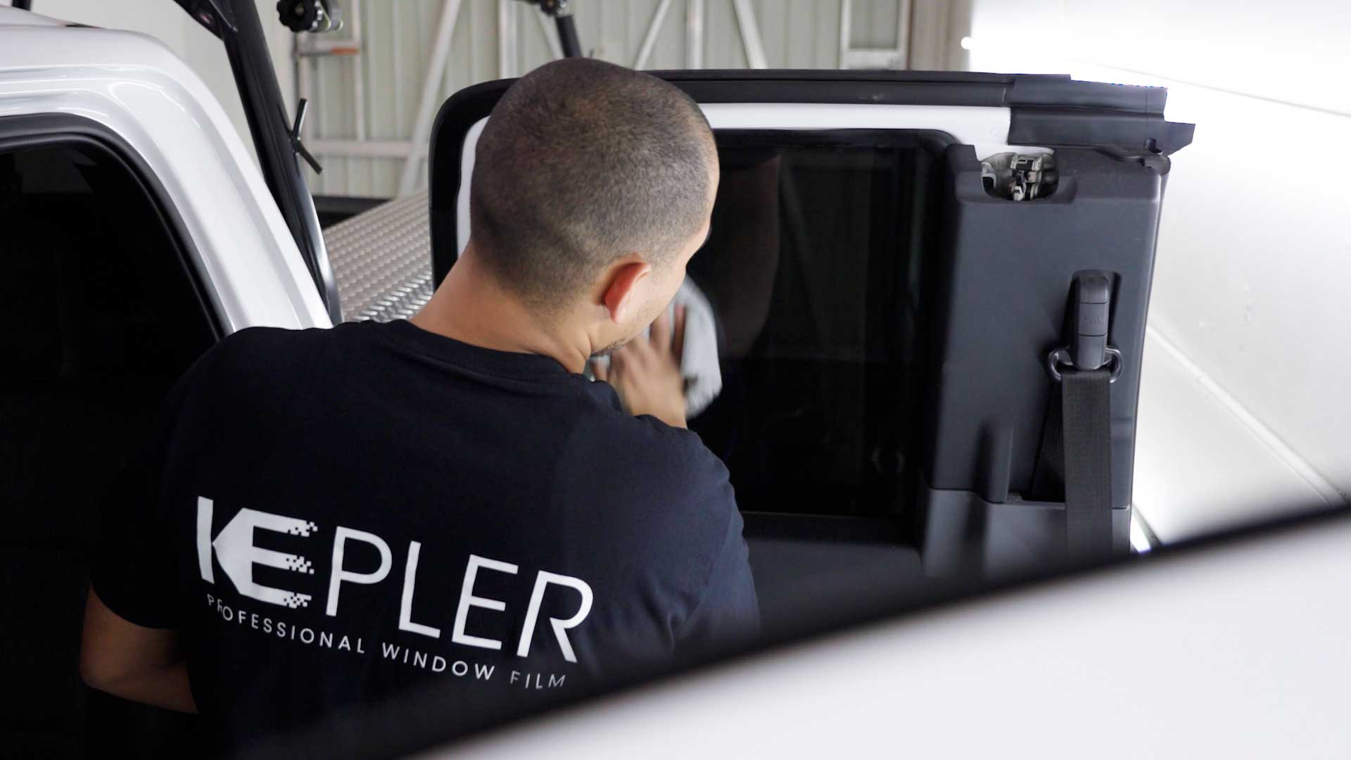 Skilled Vehicle Window Tinting being cleaned after tinting in Casa Grande
