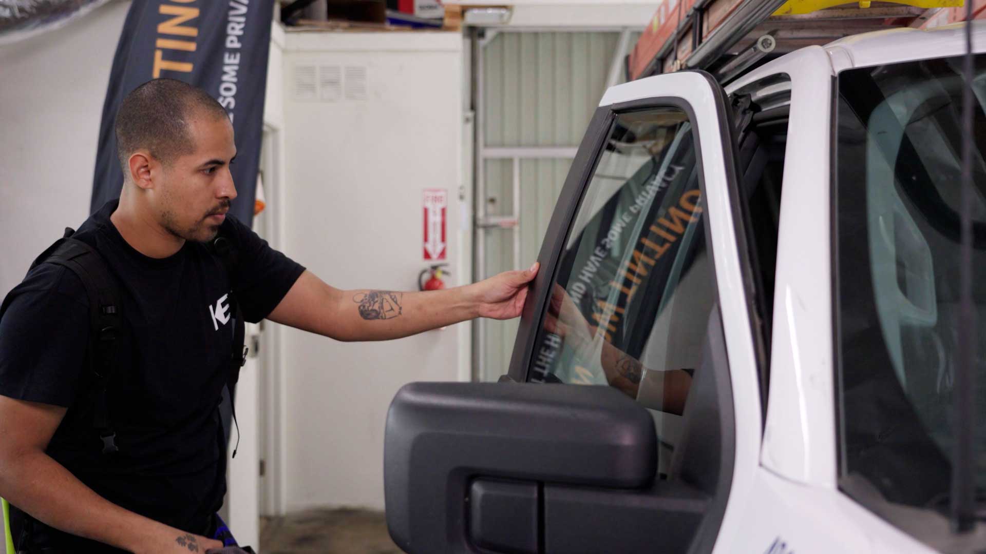 Professional Vehicle Glass Tinting being cleaned after tinting in Klamath Falls