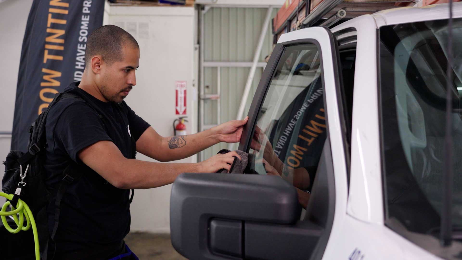 Professional Car Window Tint being cleaned after tinting in Garner
