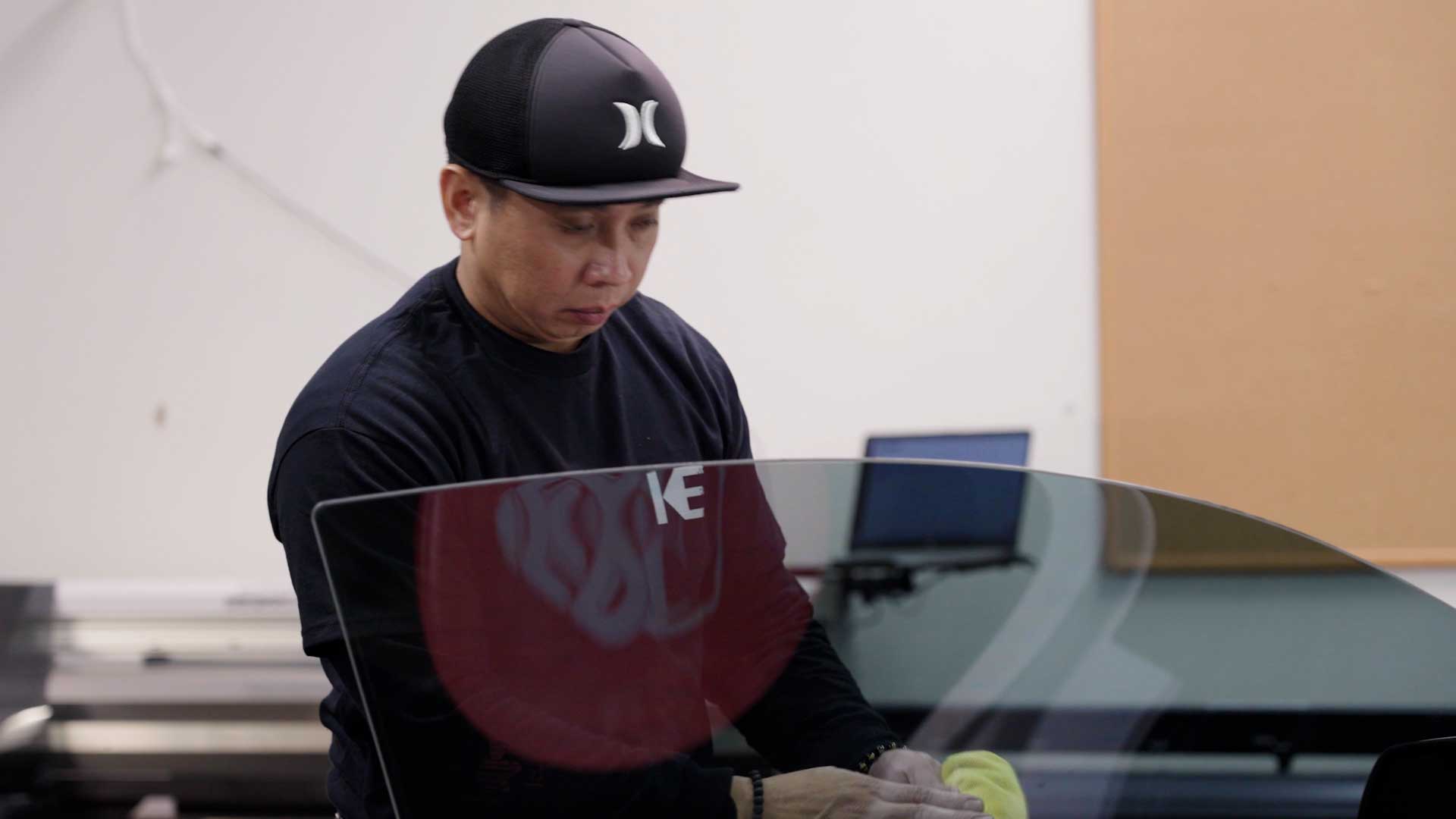 Skilled Automotive Glass Tinting being cleaned after tinting in Huntsville
