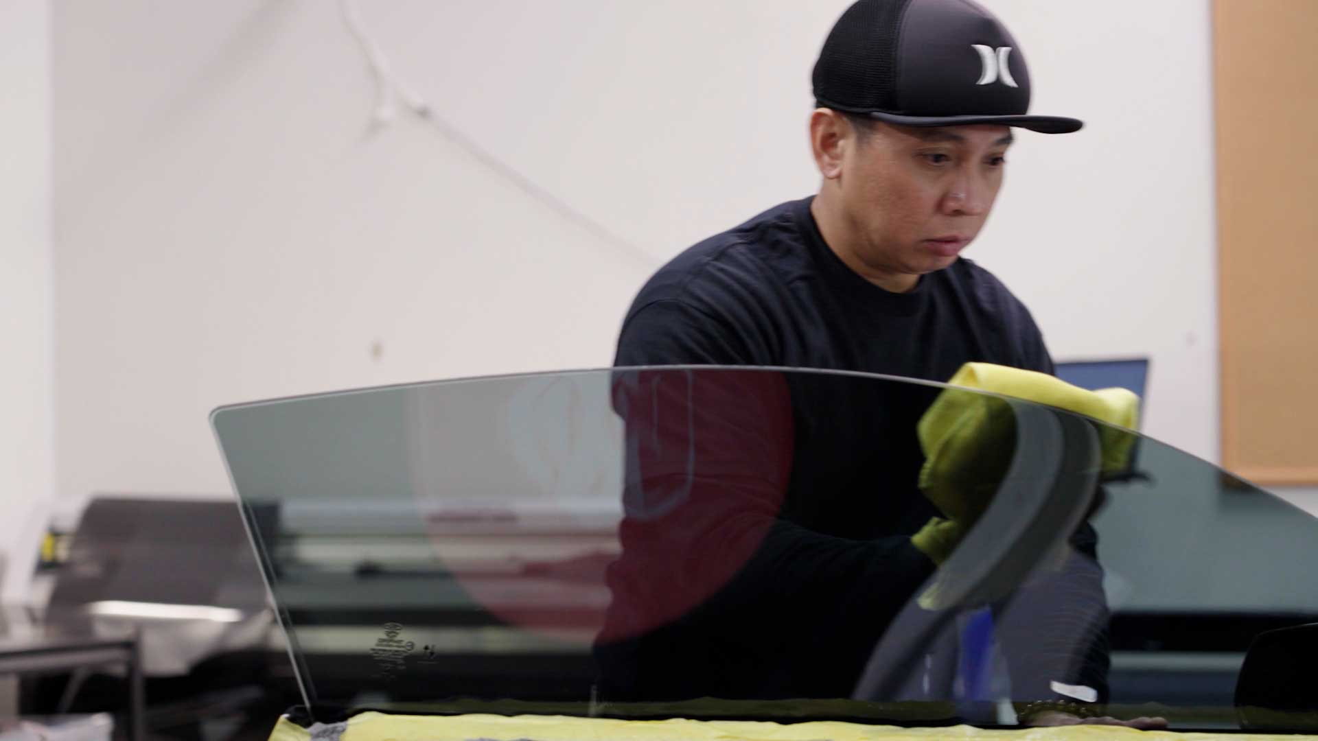 Professional Automotive Glass Tint being cleaned after tinting in Dolton