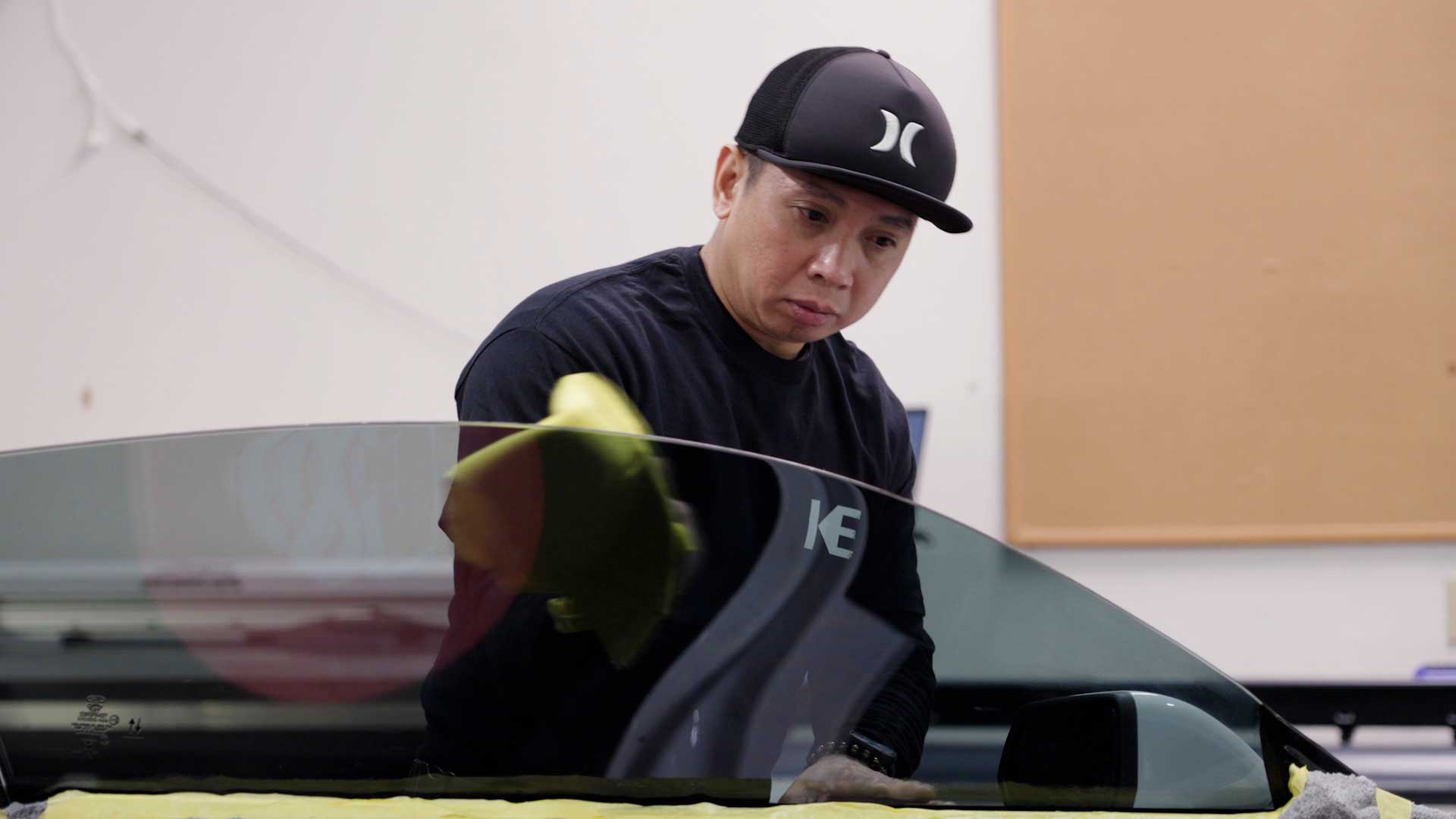 Professional Automotive Glass Tint being cleaned after tinting in La Puente