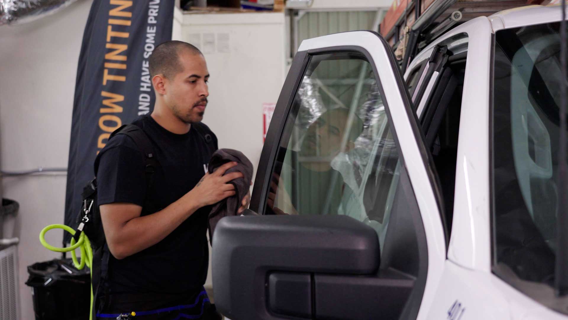 Expert Automotive Glass Tint being cleaned after tinting in Hermiston